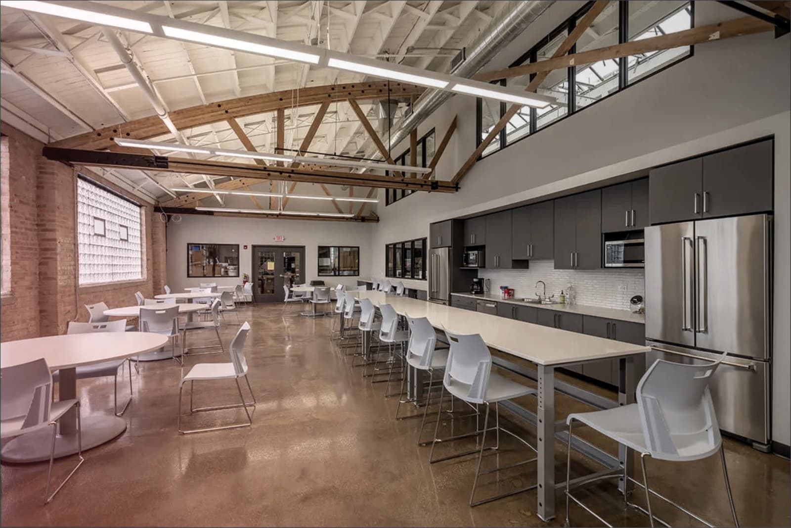 Commercial break room buildout with exposed truss ceiling completed by SNV Contracting Group in Las Vegas, NV